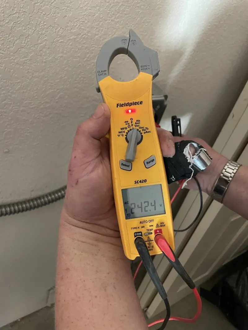 Voltage testing with clamp meter during Circuit Breaker Repair in Winona Lake